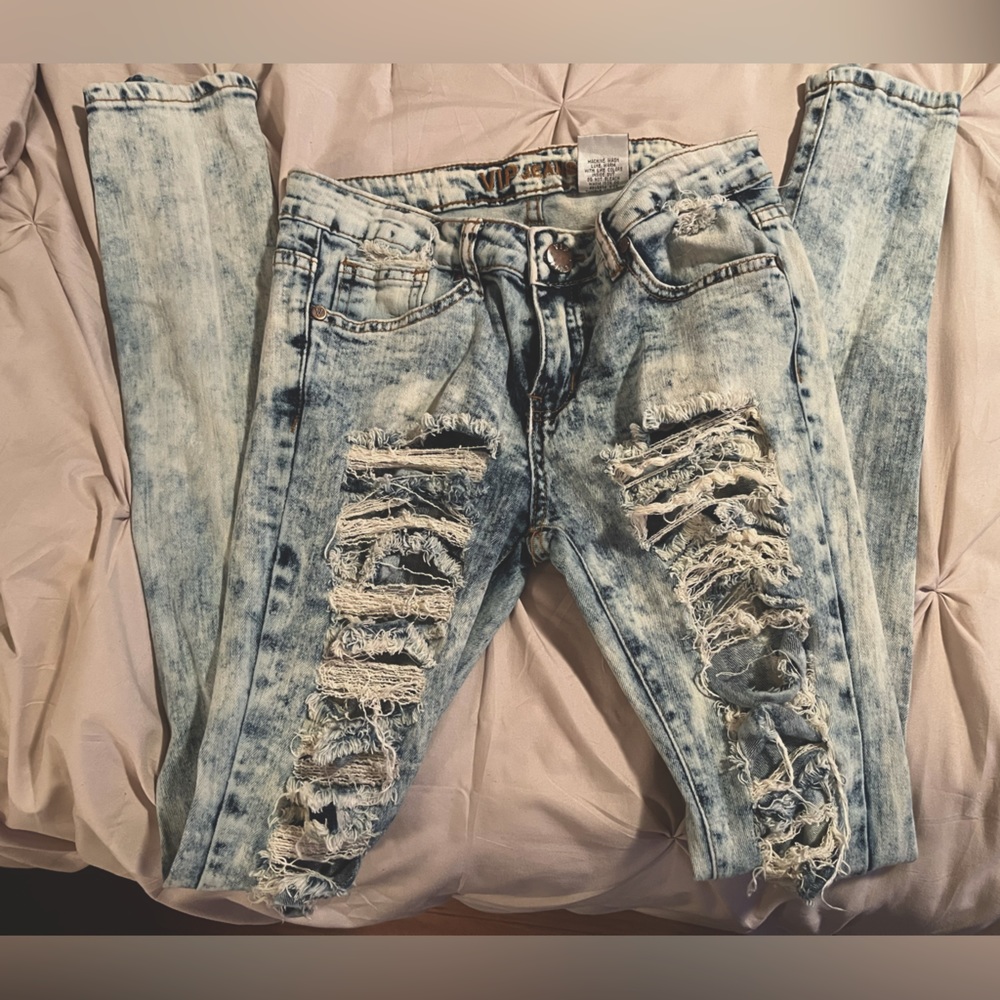Woman’s Distressed ripped bleached out jeans